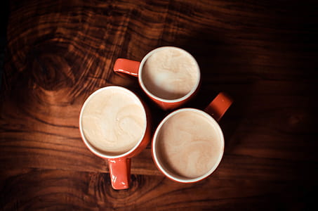 three red-and-and-white ceramic mugs thumbnail