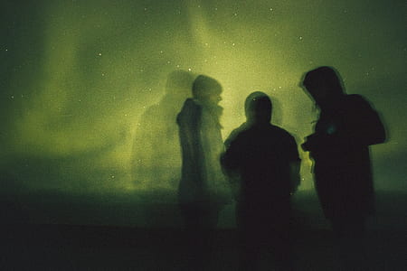 silhouette of three person during night time thumbnail