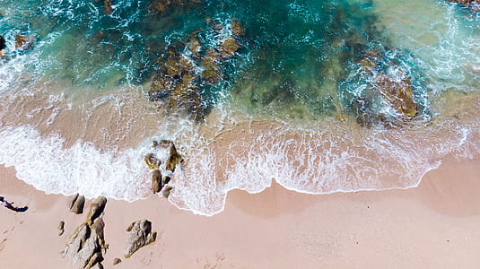 aerial view photography of sea wave on seashore thumbnail