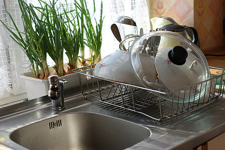 dishes on dish rack beside sink thumbnail