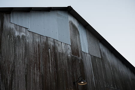 low angle photo of gray metal shed thumbnail