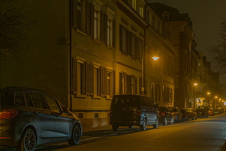 Cars in Illuminated City at Night thumbnail