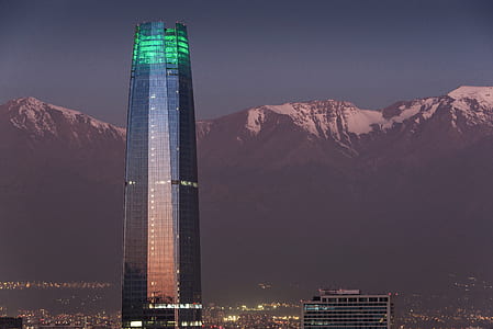 clear glass tower front of mountain thumbnail