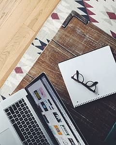 black framed eyeglasses on white printed paper thumbnail