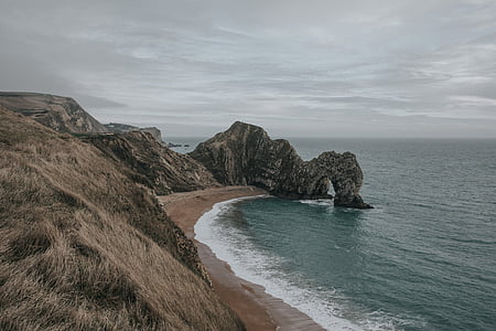 mountain range beside water thumbnail