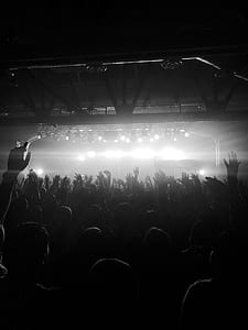 lot of people putting their hand on the air in front of stage thumbnail