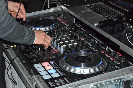 person using black DJ controller thumbnail