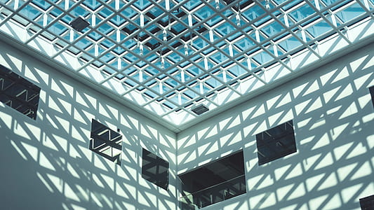 low angle photography of white concrete building thumbnail