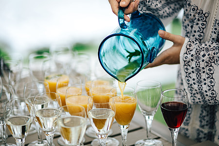 Glasses with wine and orange juice thumbnail