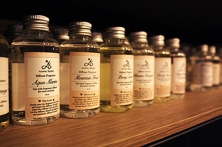 black labeled glass bottles on top of wooden surface thumbnail