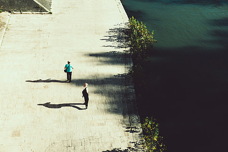 Two men walking along the waterfront thumbnail