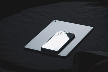 space gray iPhone X on white iPad thumbnail