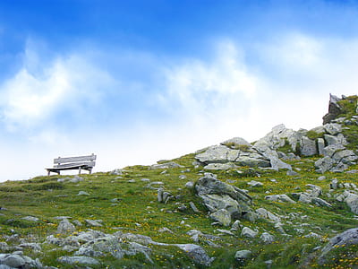 White Wooden Bench in Mountain during Daytime thumbnail