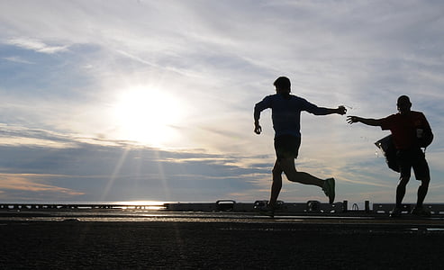 man standing on road beside another man thumbnail