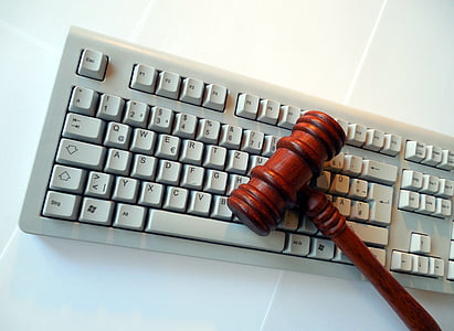 gavel on top of white keyboard on white surface thumbnail