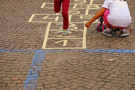 girls playing hopscotch thumbnail