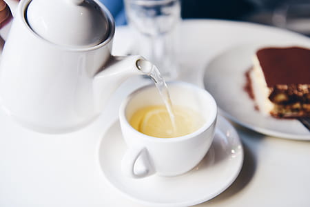 liquid poured from teapot to teacup thumbnail