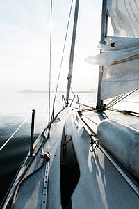 white boat facing island thumbnail