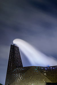 concrete building during nighttime thumbnail