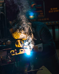 person wearing yellow welding mask thumbnail