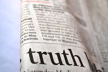 closeup photo of newspaper print showing Truth text thumbnail