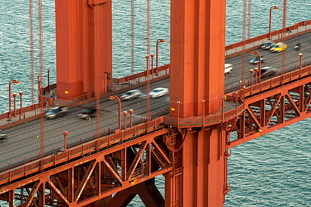 orange metal bridge during daytime thumbnail