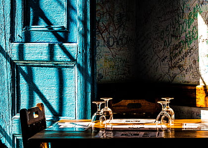 four wine glass on top of brown table thumbnail