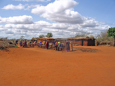 people gathered near houses thumbnail
