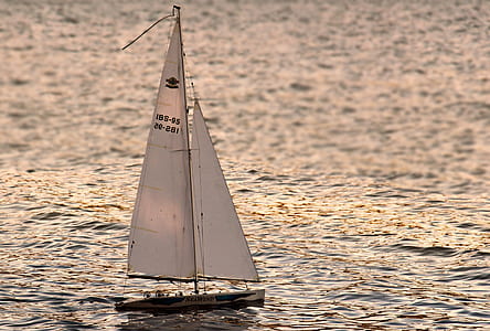 white sailboat on body of water thumbnail