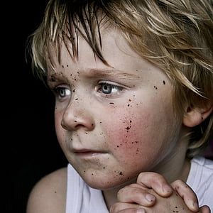 praying boy with dust on face thumbnail