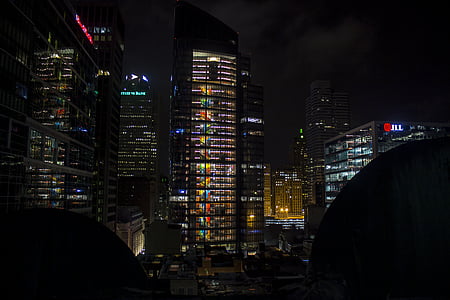 high rise buildings during nighttime thumbnail