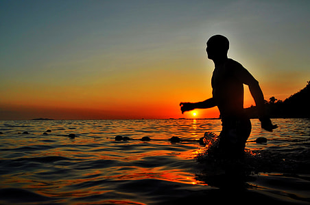 man standing on seawater thumbnail