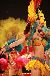 dancing woman in yellow and blue traditional costume thumbnail