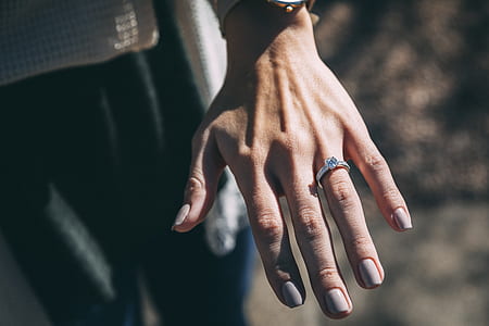 person wearing silver-colored ring thumbnail