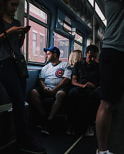 man sitting near bus window thumbnail