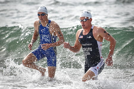 two men wading through water thumbnail
