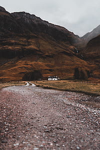 white house on brown field thumbnail