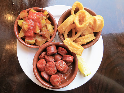 deep fried onion rings, sausages, and potatoes thumbnail