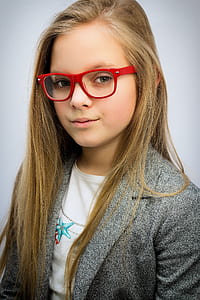 girl in gray blazer wearing red wayfarer eyeglasses thumbnail