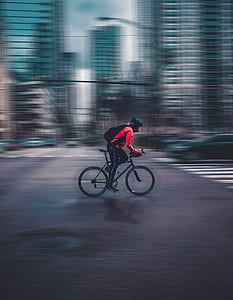 man riding road bicycle on intersection thumbnail