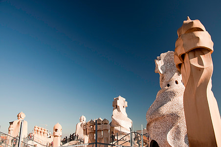 low angle photography of brown concrete statues and walls thumbnail