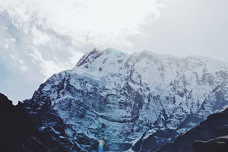 low angle photo of snow cap mountain during daytime thumbnail
