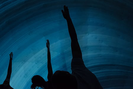 silhouette of three people doing yoga thumbnail