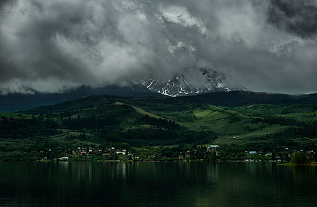 landscape photo of volcano and body of water thumbnail