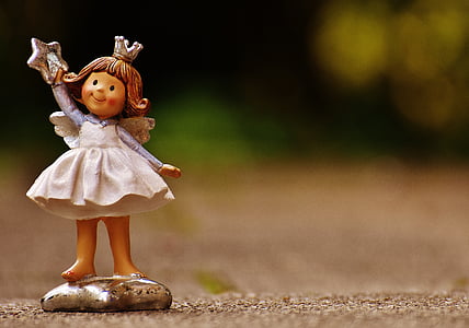 focused photo of girl ceramic figurine thumbnail