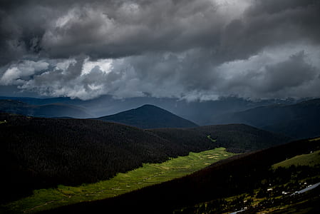 aerial photo of mountain under white sky thumbnail