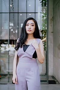 woman standing near glass panel thumbnail