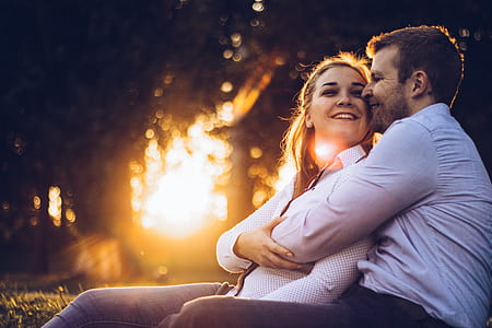 man hugging woman during daytime thumbnail