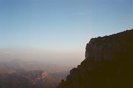 gray mountains under blue sky daytime thumbnail