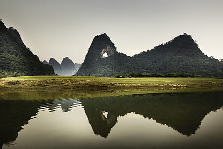 green mountain reflecting to river thumbnail